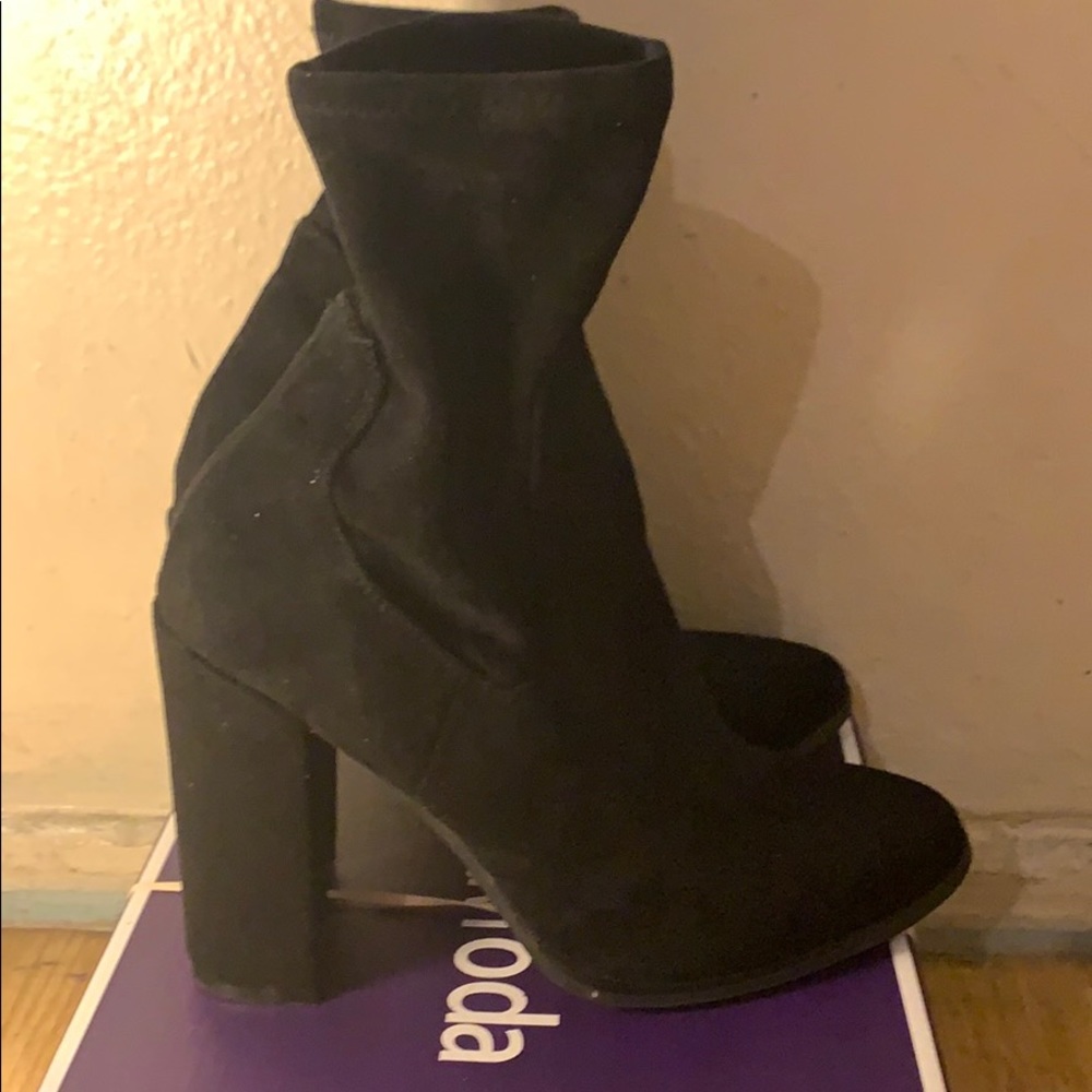 Black ankle boot heals.